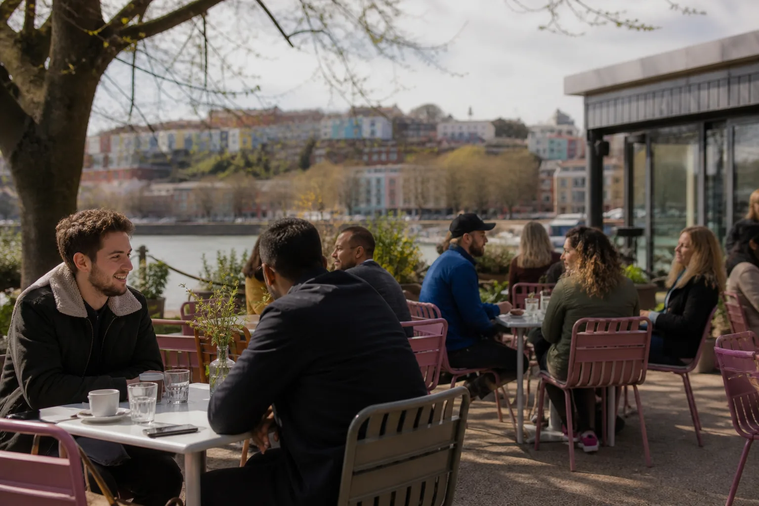 Two single people talking beside Bristol Harbourside