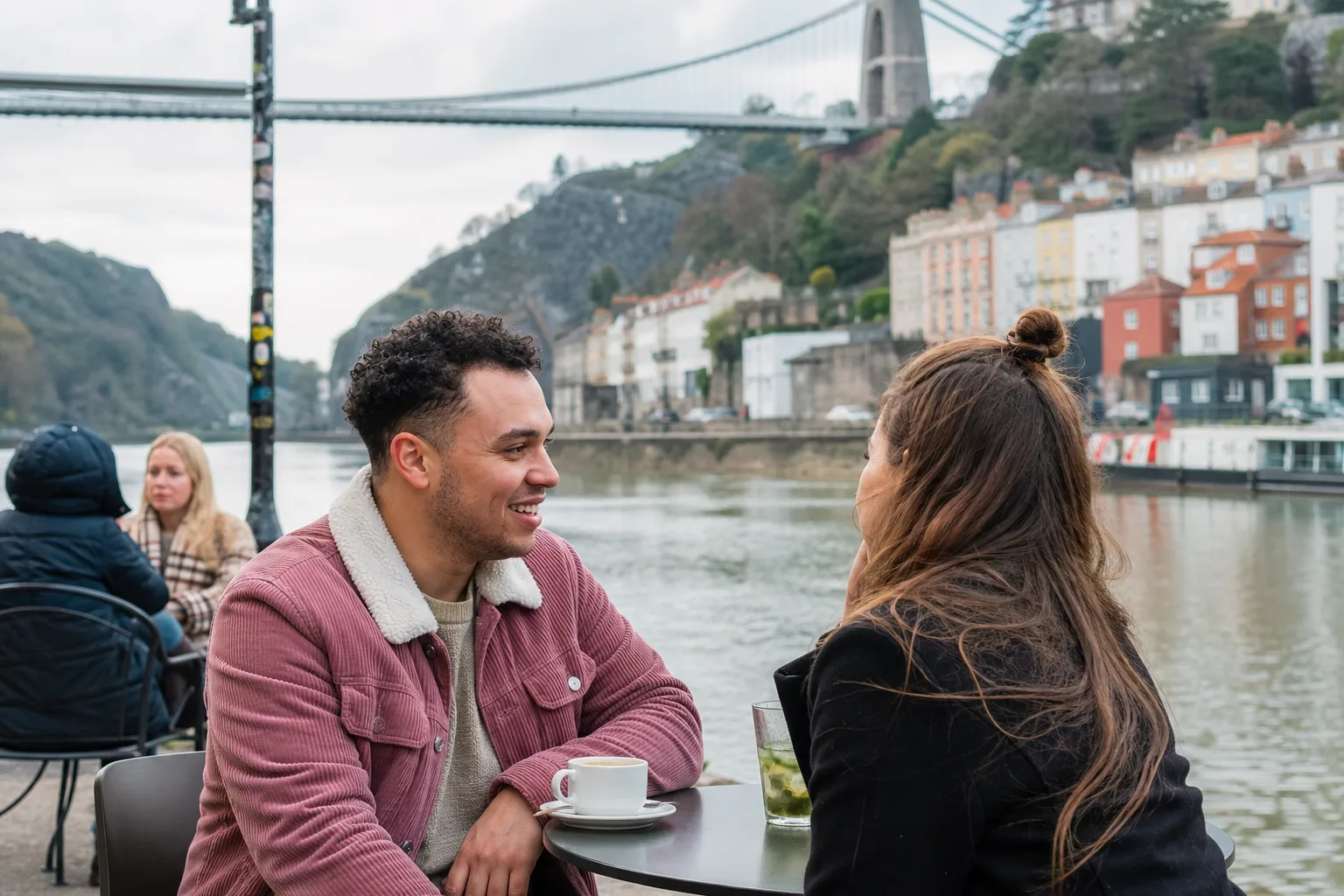 Two people walking beside Bristol Harbour on a relaxed first date